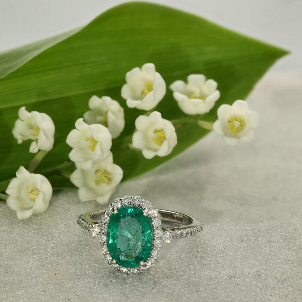 18ct White Gold Oval Emerald and Diamond Halo Cluster Ring with Diamond Shoulders