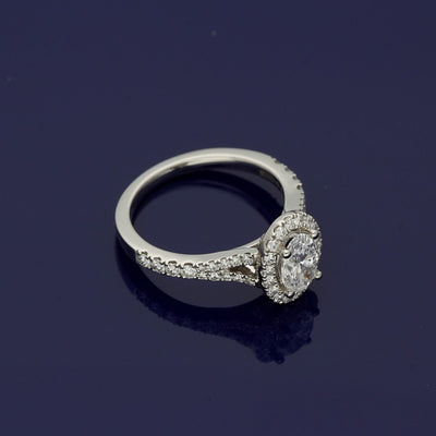 Platinum Certificated Oval Cut Diamond Halo Ring with Diamond Set Shoulders