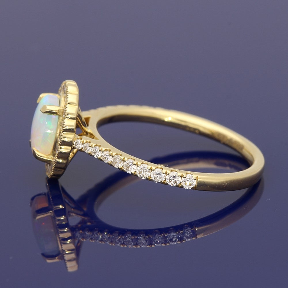 18ct Yellow Gold Oval Opal and Diamond Halo Ring