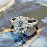 18ct White Gold 0.95ct Oval Aquamarine & Diamond Oval Halo Ring