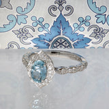 Platinum 0.77ct Oval Aquamarine & Diamond Fancy Halo Shoulders Ring