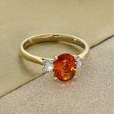 18ct Yellow Gold 0.76ct Oval Fire Opal and Diamond Trilogy Ring