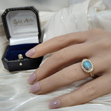 9ct Yellow Gold 0.76ct Oval Opal East/West Rub-over Set Diamond Halo Ring