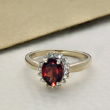 9ct Yellow Gold Oval Garnet and Diamond Halo Ring