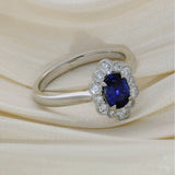 Platinum 0.83ct Oval Sapphire and Diamond Scallop Edge Halo Ring