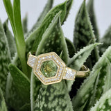 18ct Yellow Gold Green Sapphire Hexagonal Halo Ring with Trapeze Cut Diamond Shoulders