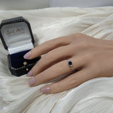 9ct White Gold East-West Set Oval Sapphire and Diamond 3 Stone Twist Ring