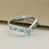 9ct White Gold Emerald & 0.26ct Diamond Claw Set Wishbone Ring