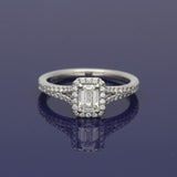 Platinum 0.51ct H SI1 Certificated Emerald Cut Diamond Halo Ring with Diamond Shoulders