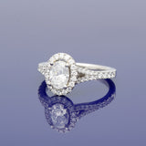 Platinum 0.71ct D SI1 Certificated Oval Cut Diamond Halo Ring with Diamond Set Shoulders