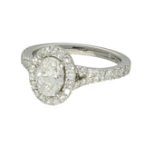 Platinum 0.71ct D SI1 Oval Cut Diamond Halo Ring with Diamond Shoulders
