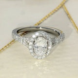 Platinum 0.71ct D SI1 Oval Cut Diamond Halo Ring with Diamond Shoulders
