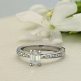 Platinum Certificated 0.53ct Emerald Cut Solitaire Ring with Diamond Shoulders