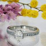 Platinum 0.70ct D SI1 Certificated Oval Cut Diamond Solitaire Ring with Princess Cut Shoulders