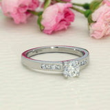 Platinum 0.50ct Diamond Solitaire Ring with Princess Cut Diamond Shoulders