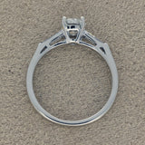 Platinum 0.71ct G SI2 Certificated Diamond Ring with Tapered Baguette Shoulders