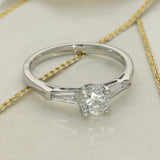 Platinum 0.71ct G SI2 Certificated Diamond Ring with Tapered Baguette Shoulders
