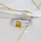 Platinum 0.54ct Natural Yellow Diamond Solitaire Ring with Tapered Baguette Shoulders