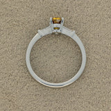 Platinum 0.54ct Natural Yellow Diamond Solitaire Ring with Tapered Baguette Shoulders