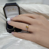 Platinum 0.54ct Natural Yellow Diamond Solitaire Ring with Tapered Baguette Shoulders