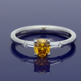 Platinum 0.54ct Natural Yellow Diamond Solitaire Ring with Tapered Baguette Shoulders