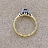 18ct Yellow Gold 0.61ct Emerald Cut Sapphire and 0.49ct Diamond 3 Stone Ring