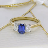 18ct Yellow Gold 0.61ct Emerald Cut Sapphire and 0.49ct Diamond 3 Stone Ring