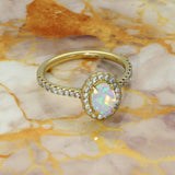18ct Yellow Gold 0.50ct Oval Opal and Diamond Halo Shoulders Ring