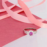 Platinum Pink Sapphire and Diamond Halo Ring with Baguette Shoulders