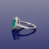 18ct White Gold Oval Emerald and Diamond Halo Cluster Ring with Diamond Shoulders