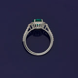 18ct White Gold Oval Emerald and Diamond Halo Cluster Ring with Diamond Shoulders