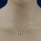 18ct White Gold 0.57ct Ruby & Diamond Oval Halo Pendant