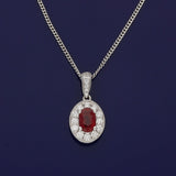 18ct White Gold 0.57ct Ruby & Diamond Oval Halo Pendant