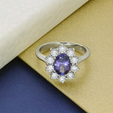 9ct White Gold Oval Tanzanite & 0.92ct Diamond Cluster Halo Ring