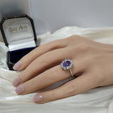 9ct White Gold Oval Tanzanite & 0.92ct Diamond Cluster Halo Ring