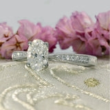 Platinum 0.70ct F VS2 Certificated Oval Cut Diamond Solitaire Ring with Diamond Shoulders