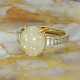18ct Yellow Gold 2.95ct Oval Yellow Opal Ring with Baguette and Round Diamond Set Shoulders