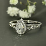 18ct White Gold 0.30ct D SI2 Certificated Pear Cut Diamond Halo Ring with Diamond Shoulders