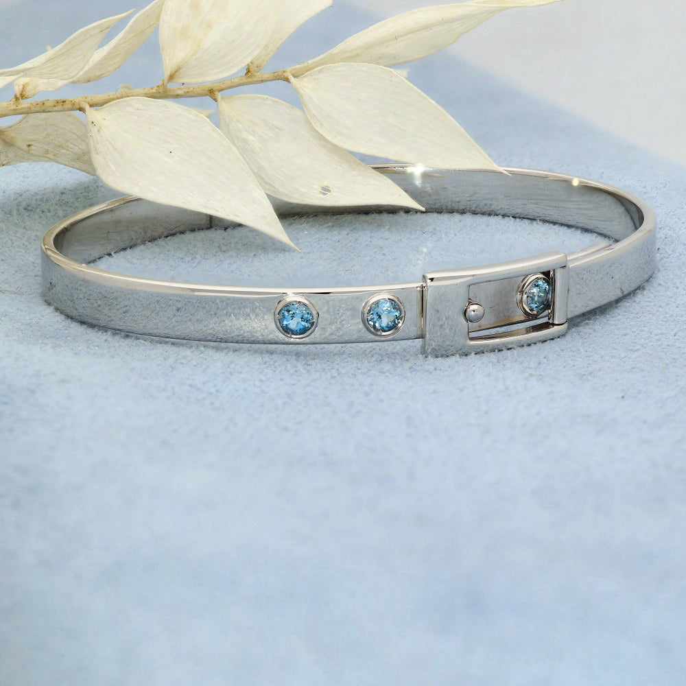 Pre-loved 9ct White Gold Blue Topaz Buckle Bangle