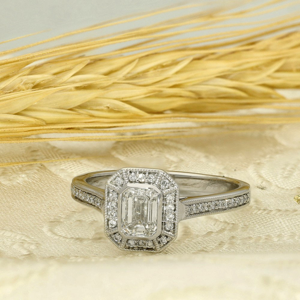 Platinum Emerald Cut Diamond Halo Ring with Diamond Shoulders