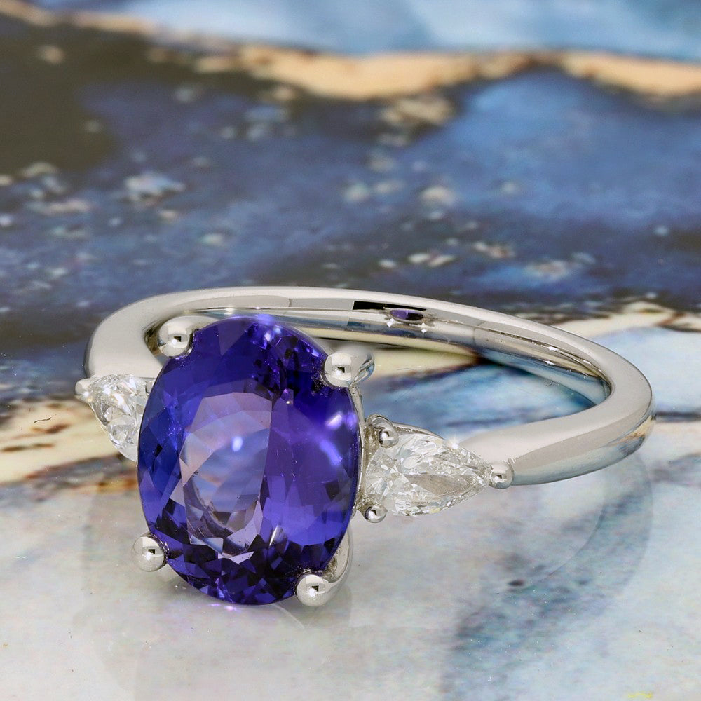 18ct White Gold Trilogy Ring with 3ct Tanzanite and Pear Shape Diamonds