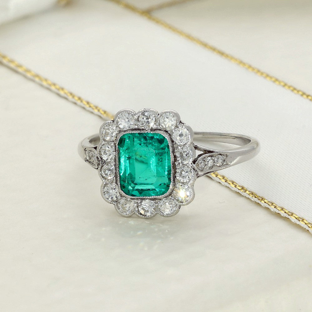 Vintage Platinum Emerald and Old Cut Diamond Halo Ring