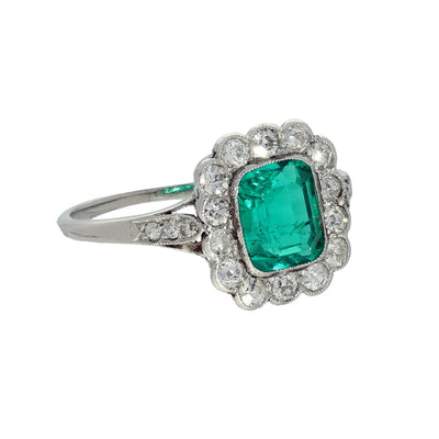 Vintage Platinum Emerald and Old Cut Diamond Halo Ring