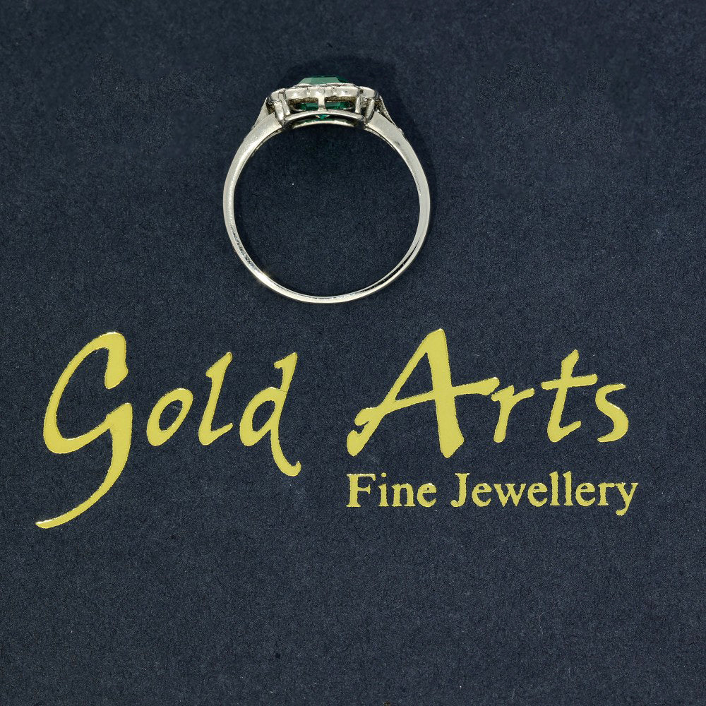 Vintage Platinum Emerald and Old Cut Diamond Halo Ring