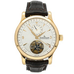 Luxury watch with gold case and black leather strap on a white background