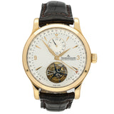 Luxury watch with gold case and black leather strap on a white background