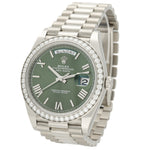 Rolex Day-Date watch with a green dial, a diamond-encrusted bezel, and a stainless steel Oyster bracelet, shown on a white background.