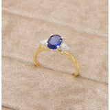 18ct Gold and Platinum, 1.07ct Oval-Cut Sapphire and .19pts Pear- Cut Diamond Trology Ring