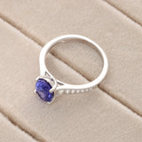 18ct White Gold 1.49ct Oval-cut Tanzanite with Tapered Diamond Soulders Ring