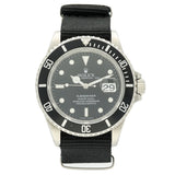 Rolex Submariner Date watch with a silver stainless steel case, black dial, black rotating bezel, and a black nylon strap, shown against a plain white background.